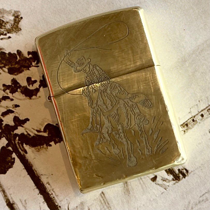 Brass Cowboy and Eagle Zippo